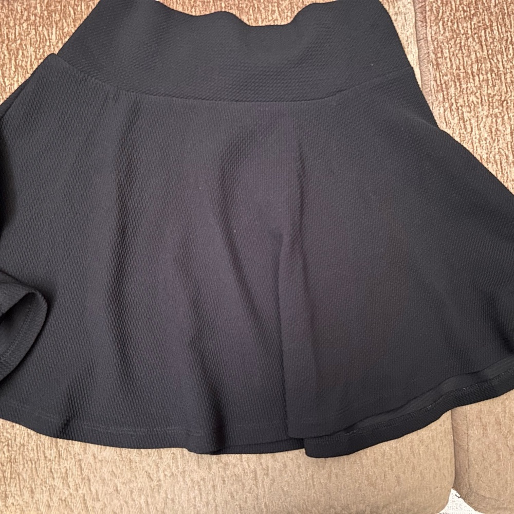 Black circle mini skirt